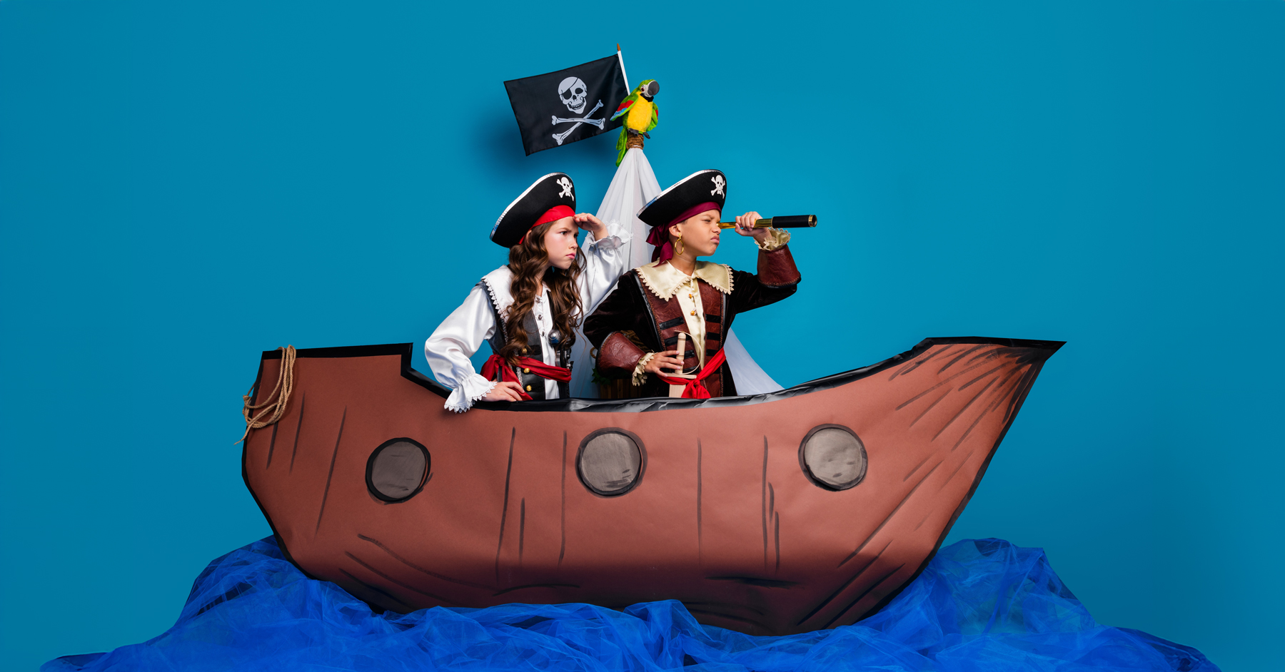 Two children pretending to be pirates
